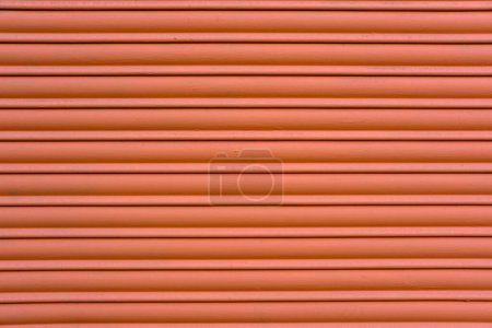 Photo for Background from a red painted roller shutter of a shop - Royalty Free Image