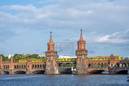 The beautiful Oberbaumbruecke in Berlin with a yellow subway train