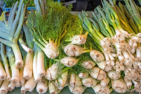 Celery, leek and spring onion for sale at a market