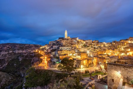Photo for Matera in southern Italy with the Gravina at night - Royalty Free Image