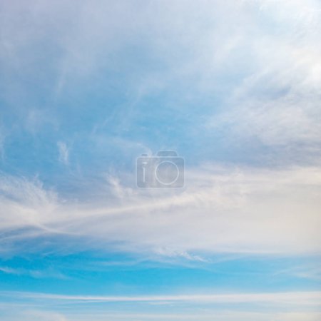 Foto de Beautiful white clouds on bright blue sky background. - Imagen libre de derechos