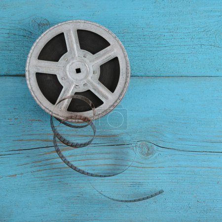 Photo for Old film strip on wooden blue background. - Royalty Free Image