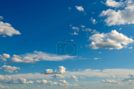 Photo for White fluffy clouds on bright blue sky. - Royalty Free Image