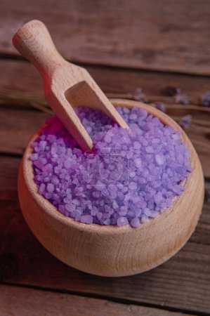 Photo for Lavender cooking salt in wooden bowl with spoon on devan background, rustic style, craft, homeware - Royalty Free Image