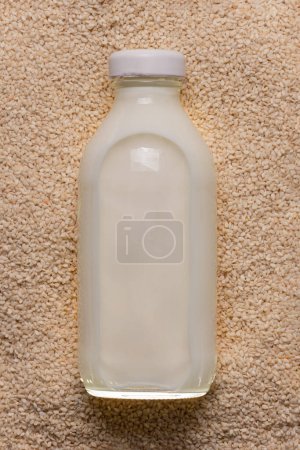 Photo for Alternative vegan milk based on sesame seeds. Nutritious eco drink - Royalty Free Image