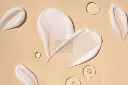 Photo for Brushes of cream in the form of a heart. Concept: self-love. Moisturizing face cream with peptides. Background, texture, mockup, latest technologies, peptide complex. Skin youth, modern care at home - Royalty Free Image