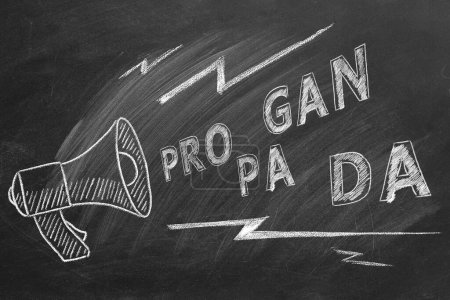 Photo for Propaganda and fake news concept. Illustration on blackboard. A megaphone with the word propaganda. Misinformation and counterinformation concept. - Royalty Free Image