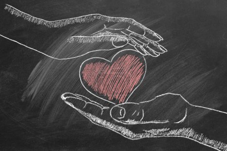 Téléchargez les photos : Male and female hands with heart. Concept of Love, Life, Care, Compassion, Mercy, Philanthropy, Health. I Love You. Happy Valentines day. World heart day. Chalk drawn illustration. - en image libre de droit