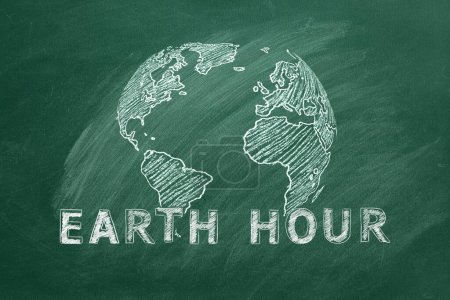 Photo for Rotating globe with lettering EARTH HOUR hand drawn in chalk on a school greenboard. Save the World. Save our planet. - Royalty Free Image