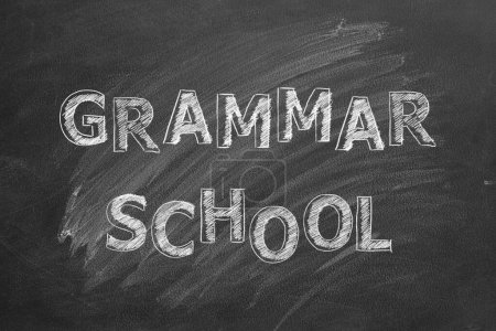 Photo for Lettering Grammar school on black chalkboard. - Royalty Free Image