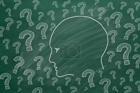 Photo for Human head with question marks. Illustration on greenboard. - Royalty Free Image