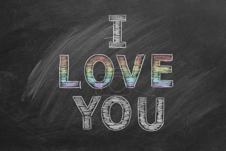 Photo for I love you. Inscription in chalk on the blackboard with rainbow colors. LGBT, LGBTQIA rights and gender equality concept. Pride month. Declaration of love, acceptance of feelings, giving love. - Royalty Free Image
