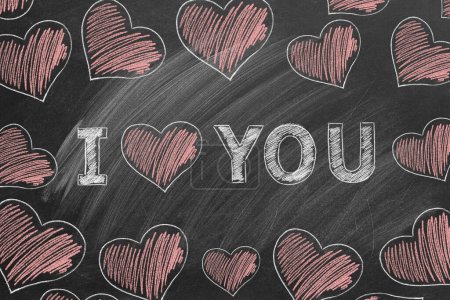 Photo for I LOVE YOU. Inscription in chalk on the school blackboard. Valentines day. Love concept. Declaration of love, falling in love - Royalty Free Image