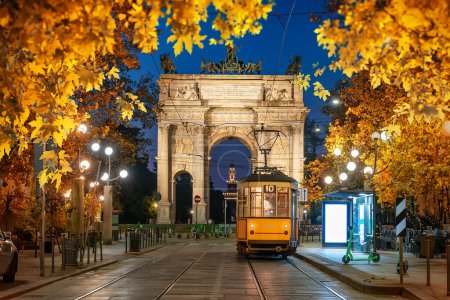 Photo for View of the Peace Arch with yellow tram in Milan, Italy - Royalty Free Image