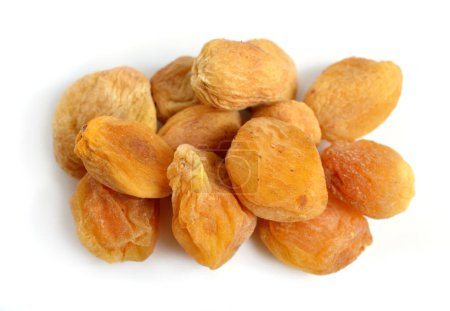 Photo for Whole Sun-dried apricots with stones. Isolated on white background. - Royalty Free Image