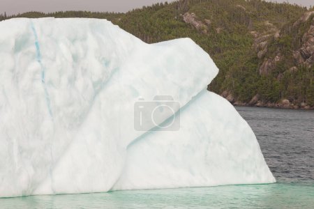 Photo for Part of huge melting iceberg in coastal waters of Atlantic Ocean off Newfoundland, NL, Canada - Royalty Free Image
