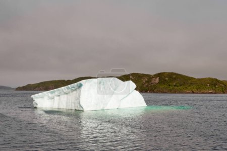 Photo for Melting iceberg in coastal waters of Atlantic Ocean off Newfoundland, NL, Canada - Royalty Free Image