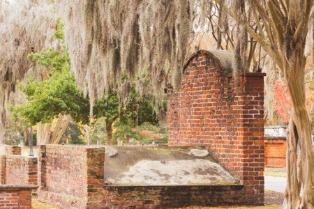 Photo for Old masoned brick grave in Colonial Park Cemetery graveyard in Historic District of downtown city of Savannah, Georgia, GA, USA - Royalty Free Image