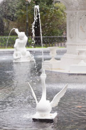 Photo for Spouting White Swan Figure of Forsyth Park Fountain famous landmark in Historic District of City of Savannah, Georgia, USA - Royalty Free Image
