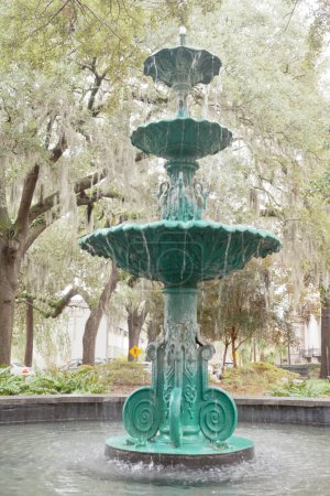 Photo for Water fountain under oaks of Lafayette Square in Historic District of downtown city of Savannah, Georgia, GA, USA - Royalty Free Image