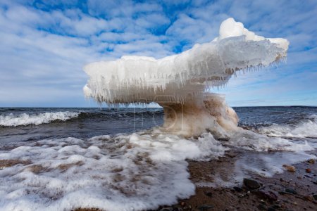 Photo for Bizarre chunk of stranded ice floe thawing on sandy Melmerby Beach, Merigomish, Pictou County, Nova Scotia, NS, Canada - Royalty Free Image