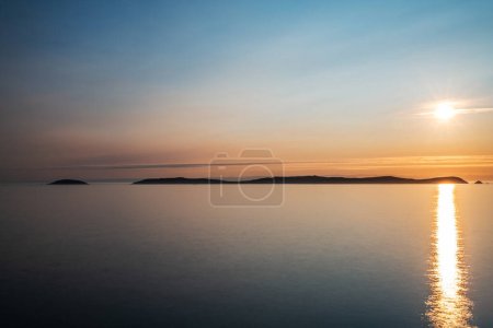 Photo for Sunset falling over Ons Island in Galicia, an island designated a Special Protection Area for bird-life in 2001 by the European Union. - Royalty Free Image