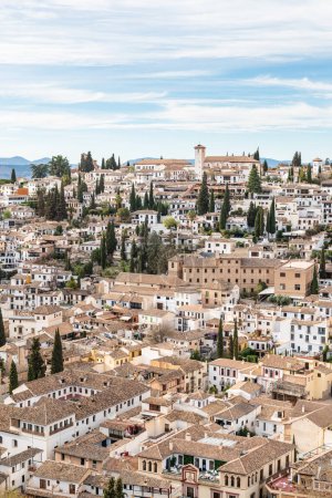 GRANADA, SPAIN: MARCH 24, 2023: Aerial view of the Albaicin in Granada, one of the oldest districts in the city, with its historic monuments and traditional houses.
