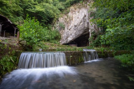 Photo for Petnicka pecina cave and river Banja spring, Petnica, Valjevo, Serbia. Long exposure - Royalty Free Image