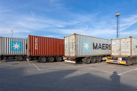 Photo for Dobanovci, Serbia - October 18, 2023: Transport Container on truck, yard for Logistic Import Export company. Reach Stacker Lifting Logistics Shipping Container at Cargo Terminal. - Royalty Free Image