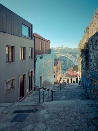 Foto de PORTO, PORTUGAL - CIRCA JANUARY, 2023: Narrow streets in Oporto city in Portugal. The historic centre of Porto was designated a UNESCO World Heritage site in 1996. - Imagen libre de derechos