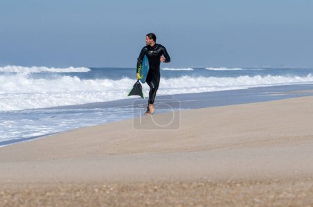 Photo for Bodyboarder running in S. Torrao do Lameiro in Ovar - Portugal. - Royalty Free Image