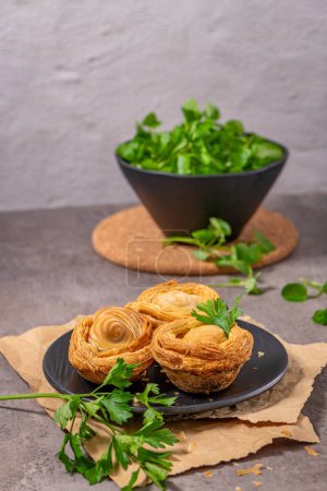 Photo for Pastries filled with meat, traditionally baked in black clay molds both from the region on Vila Real, Portugal. - Royalty Free Image