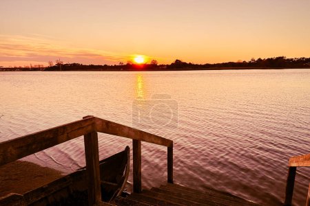 Azurreira, Ovar, Portugal. Wide view of the natural scenery of sunset over the water in Ria de Aveiro.
