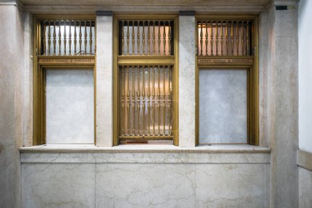 Photo for Interior, old, vintage, post office, postal, window, closed, out of service, bars, marble, wall, institution, bank, financial - Royalty Free Image