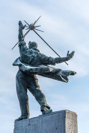 Photo for KIEV, UKRAINE - JANUARY 18, 2017: Monument to the Conquerors of Nuclear Energy, Soviet art  style Statue , Metro Bridge, Kiev, Ukraine - Royalty Free Image