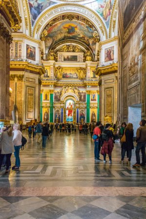 Photo for ST. PETERSBURG, RUSSIA - MAY 30, 2017: Tourists visiting the majestic interiors of St. Isaac's Cathedral - Royalty Free Image