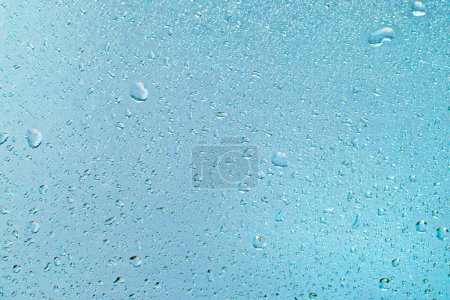 Photo for Turquoise Water drips taken closeup as abstract background. - Royalty Free Image