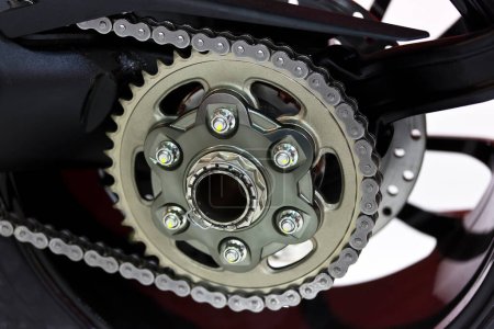 Toothed chain on the rear wheel of a motorcycle. Mechanism, gears and chain.