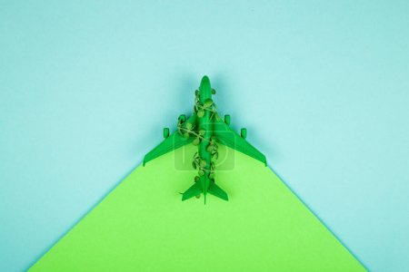 Photo for Sustainable aviation concept - green plane. Background with copy space. - Royalty Free Image