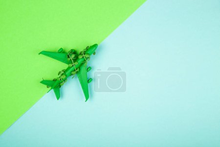 Photo for Sustainable aviation concept - green plane. Background with copy space. - Royalty Free Image