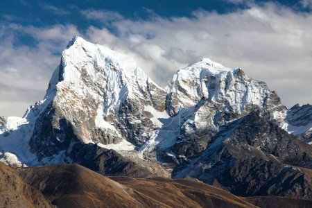 mounts Arakam Tse, Cholatse and Tabuche Peak in the middle of clouds trek to Everest base camp, view from Gokyo peak, Nepal
