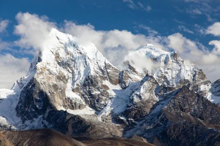 mounts Arakam Tse, Cholatse and Tabuche Peak in the middle of clouds trek to Everest base camp, view from Gokyo peak, Nepal