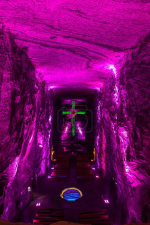 Photo for Illuminated cross representing stations of the cross, illustrate events of Jesus last journey, light in underground Catedral de Sal (Salt Cathedral) of Zipaquira, one of Colombian wonders, Colombia. - Royalty Free Image