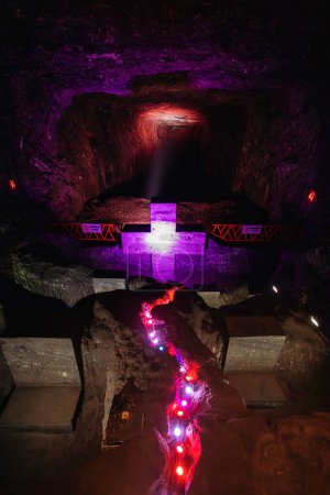 Photo for Illuminated cross representing stations of the cross, illustrate events of Jesus last journey, light in underground Catedral de Sal (Salt Cathedral) of Zipaquira, one of Colombian wonders, Colombia. - Royalty Free Image