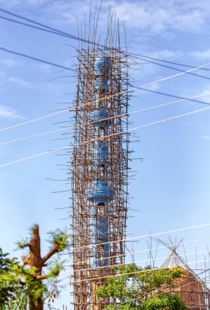 Repairing a mosque using traditional african bamboo scaffolding, Dembecha City, Amhara Region Ethiopia