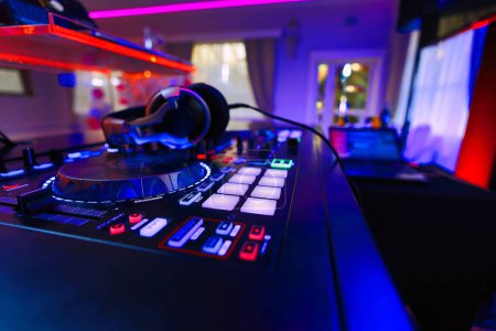 Photo for DJ table mixer closeup in the empty nightclub before the party. - Royalty Free Image