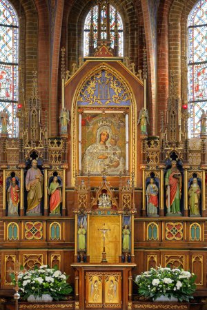 Photo for Poland, Gietrzwald, Warmia - Masuria Province - 04.08.2023: : Basilica Shrine of Our Lady Gietrzwald, presbytery with an image of Mary the Mother of Go - Royalty Free Image
