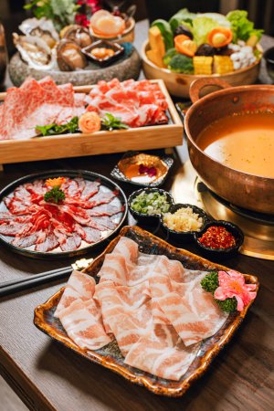 Photo for Seafood cuisine plate and beef sliced meat for hot pots. pork slices, scallops,  seashells, oysters, caviar and other seafood delicacies. - Royalty Free Image
