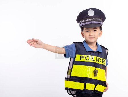 Photo for Child dressed as a police officer standing before white background - Royalty Free Image