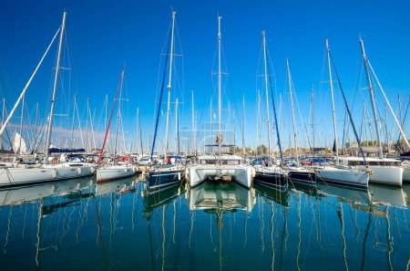 Photo for Yacht marina. Yacht pier.  Many sailing boats are at the pier. Nice trip around the islands, great weekend getaways and holidays. Greece, Europe. - Royalty Free Image